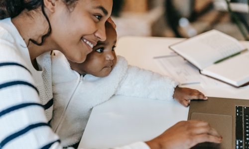 mother at computer with child